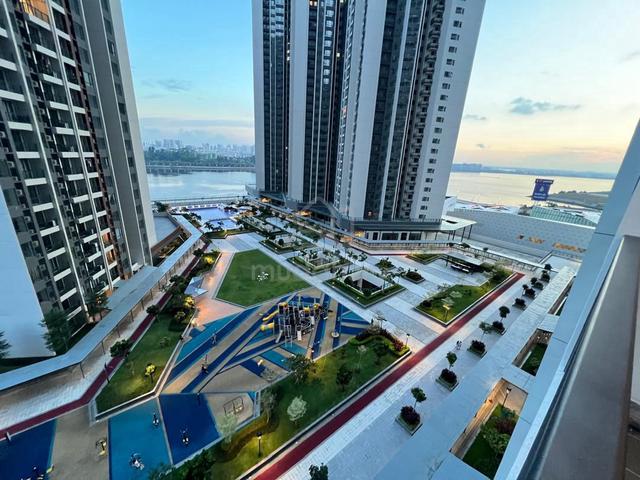 R&F Princess Cove playground, fitness area, and swimming pool with Johor Bahru waterfront view in the background
