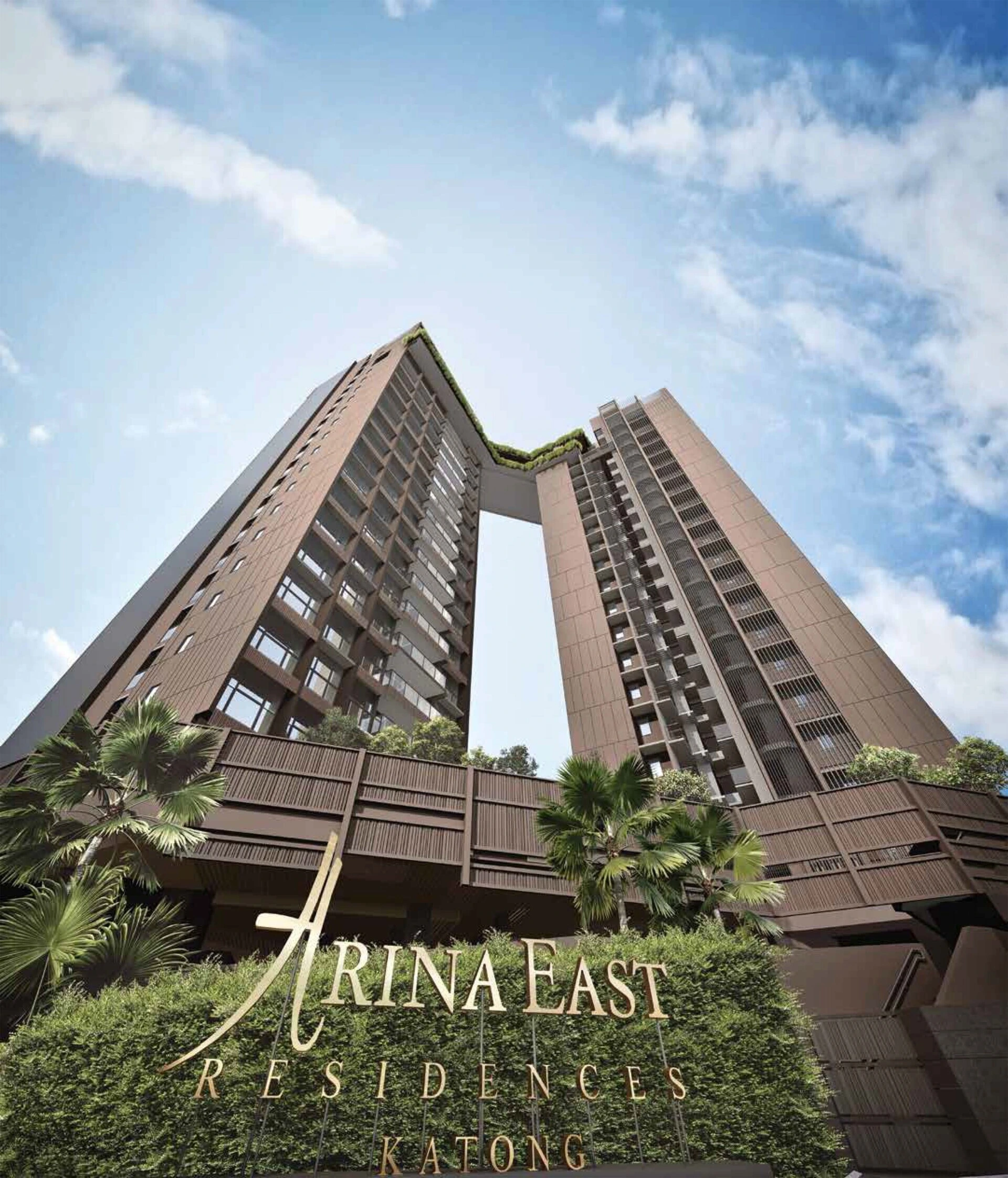 Ground-level view of Arina East Residences twin towers with logo displayed